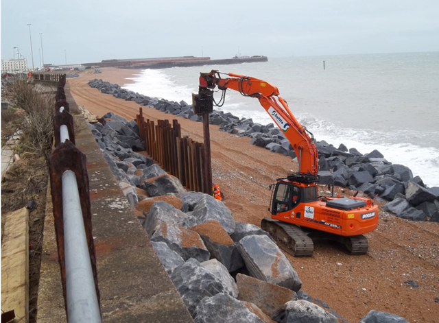 Dover - piling on the beach: Dover - piling on the beach and twin lines of granite rock armour