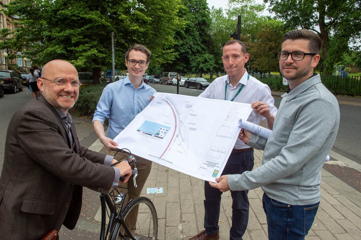 Minister for Active Travel Patrick Harvie, Cllr Angus Millar and the Glasgow City Council project team look at the design map Cllr Angus Millar and Minister for Transport Patrick Harvie look at the design map for the Connecting Battlefield Active Travel Project