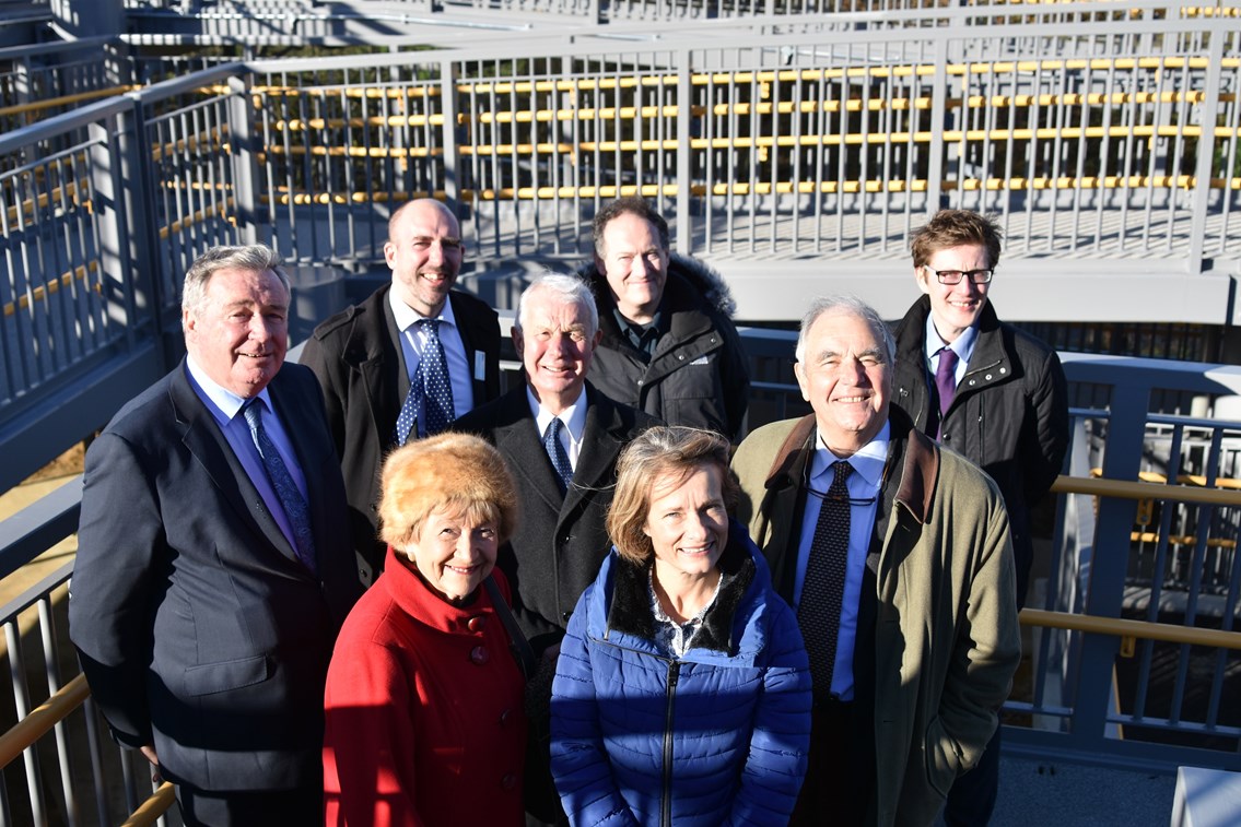 Stuart Kistruck, Network Rail, marks the official opening of Rosa's bridge in Gomshall alongside Sir Paul Beresford MP, and members of Rosa's family: Back row (l-r): Stuart Kistruck, Network Rail director of route asset management; David Gould, Rosa Sigal's great-nephew; Tom Pierpoint, Great Western Railway. 
Middle row (l-r): Sir Paul Beresford, MP for Mole Valley; Cllr Keith Taylor, Surrey County Council; Cllr David Wright, Guildford Borough Council. 
Front row (l-r): Beatrice Gould, Rosa Sigal's niece, Cllr Candace Brooke, Shere Parish Council.