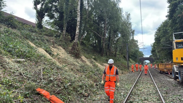 Network Rail engineers removing vegetation from the Cross City line between Birmingham and Lichfield: Network Rail engineers removing vegetation from the Cross City line between Birmingham and Lichfield