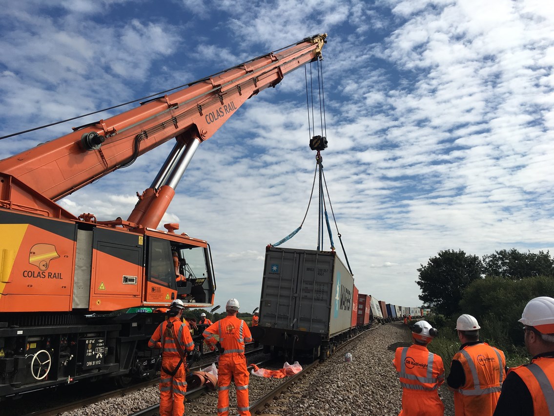 Line between Ely and Peterborough reopens following major recovery operation: Rail crane lifts wagons and containers