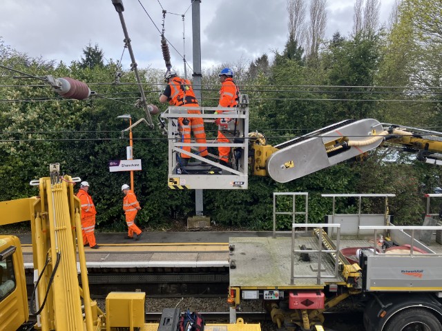 Network Rail engineers carrying out maintenance work on the overhead lines at Shenstone station: Network Rail engineers carrying out maintenance work on the overhead lines at Shenstone station