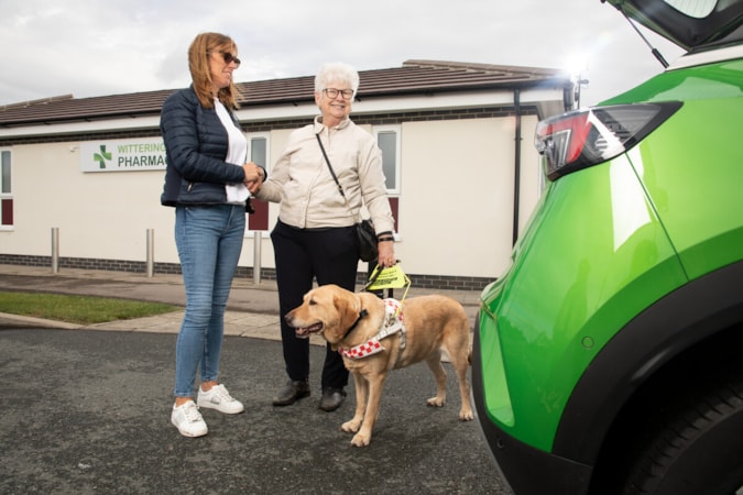 Motability Scheme customer with assistance dog