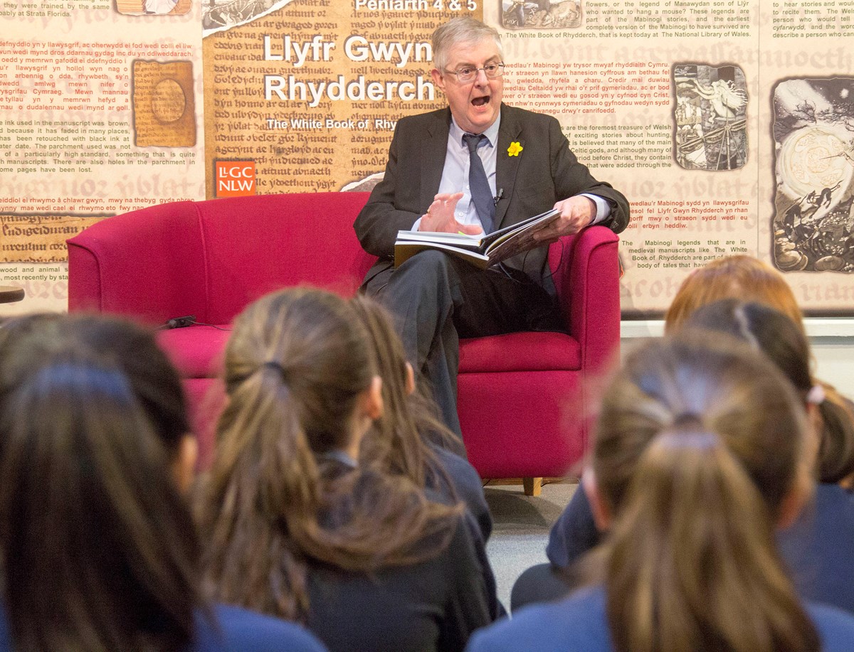 First Minister reads extracts of the Mabinogion to school pupils in the national Library of Wales ahead of World Book Day