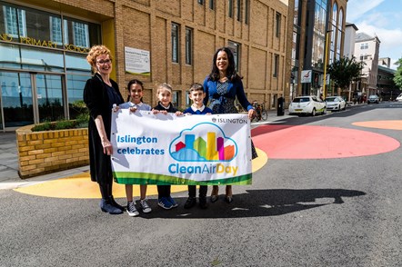 Children join Ann Dwulit, executive headteacher of Moreland Primary School (L) and Cllr Claudia Webbe (R) for the launch of Moreland Street on Clean Air Day 2019