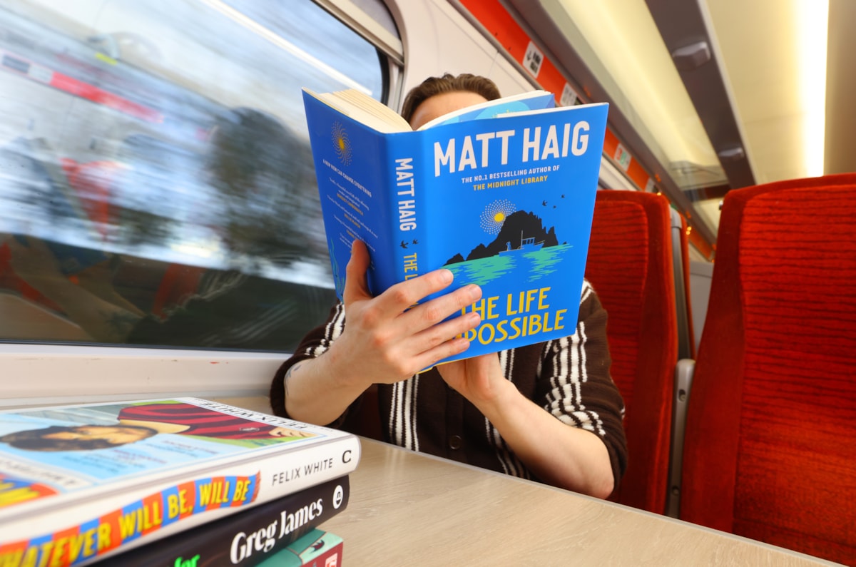 Person Reading A Book on LNER Azuma Train