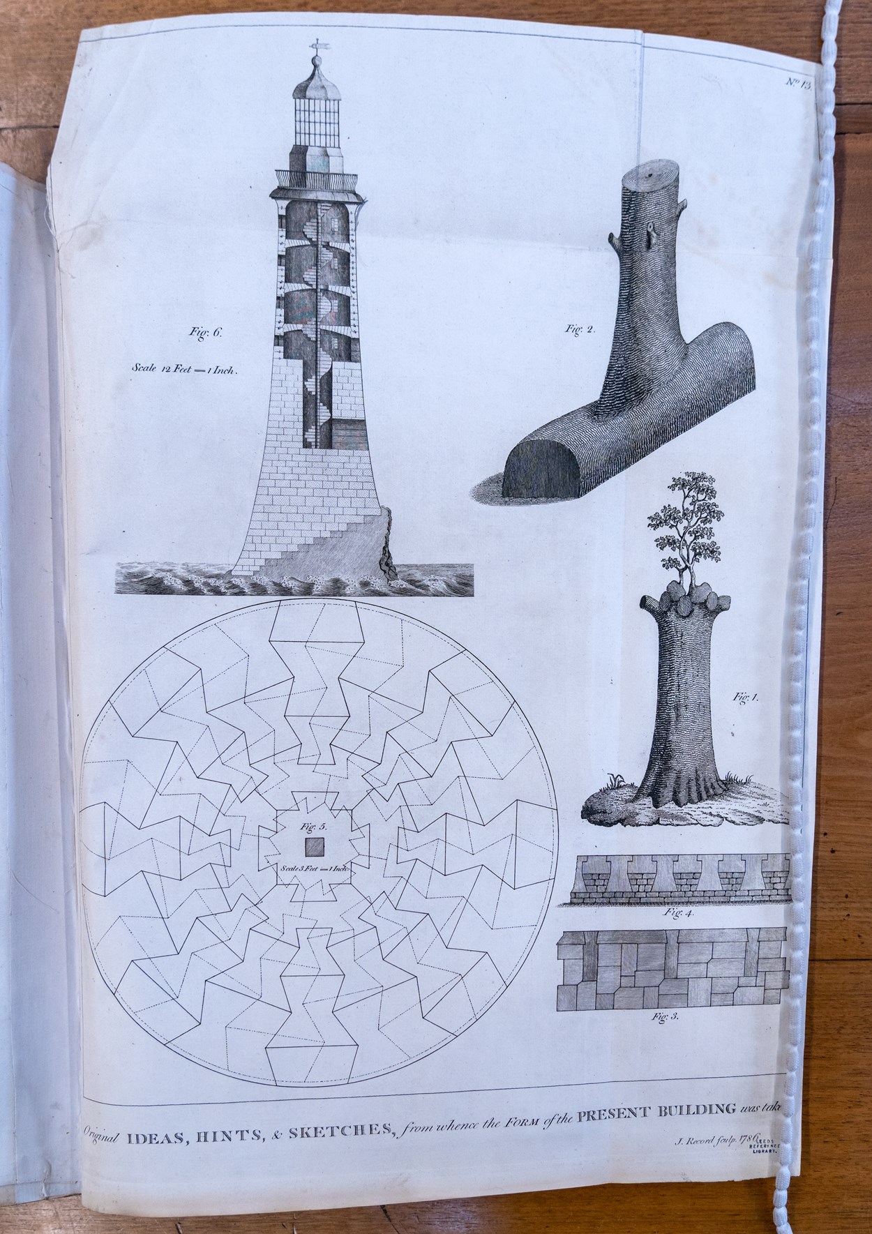 Engineery: Pages from the book containing original plans for John Smeaton's famous Eddystone Lighthouse. The beautiful first edition, penned by Smeaton himself, is on loan from Leeds Central Library, and is among the fascinating objects featured in Engineery, a new exhibition which has opened at Leeds Industrial Museum. Image credit: Anthony Robling.