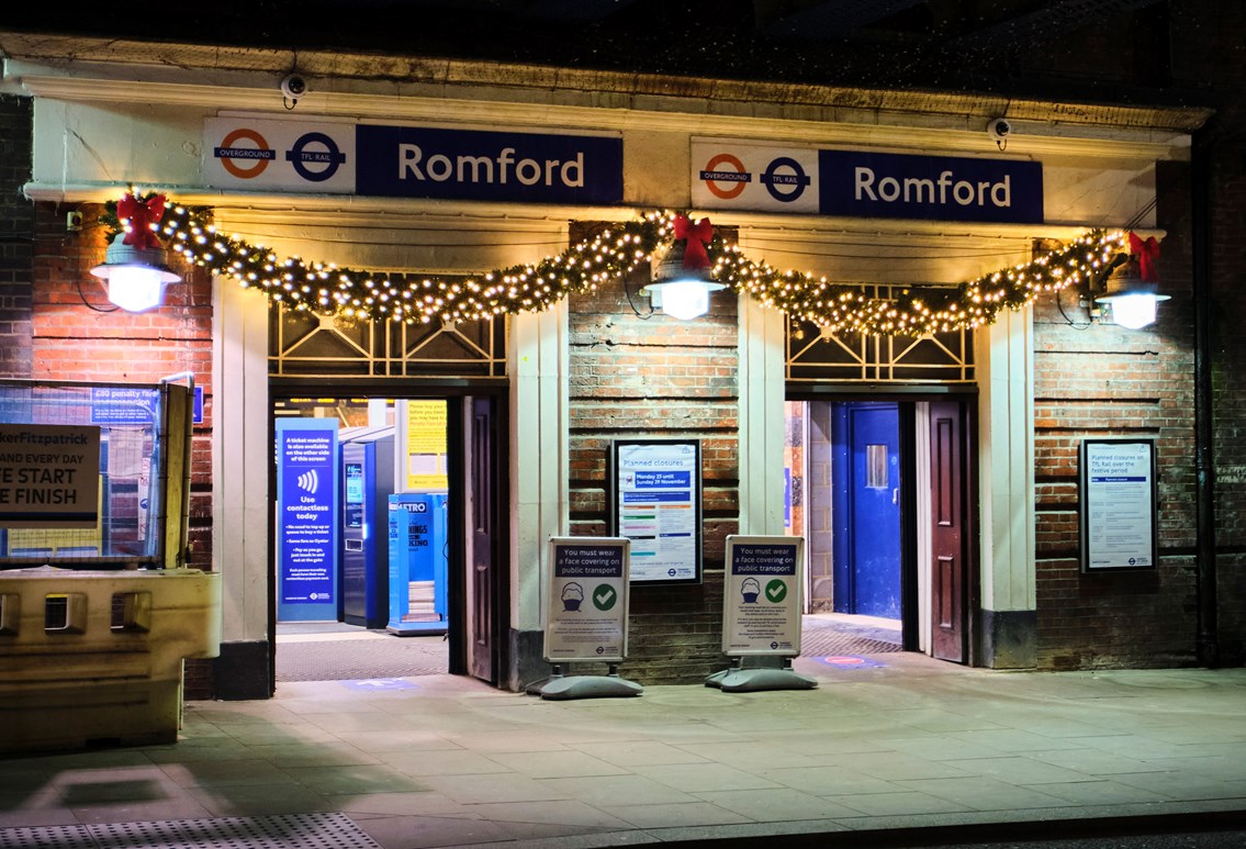 Businesses and rail companies come together to bring Christmas cheer to Romford train station: Christmas garland over the entrance to Romford station