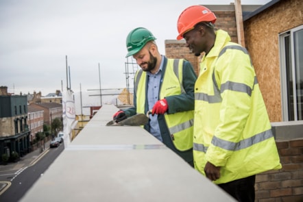 Mayor of Hackney Philip Glanville with Trainee Assistant Site Manager at Quadrillion Construction Thaddeus Buffong