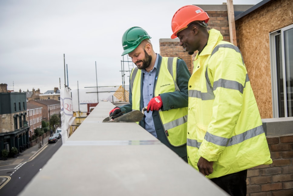 Mayor of Hackney Philip Glanville with Trainee Assistant Site Manager at Quadrillion Construction Thaddeus Buffong