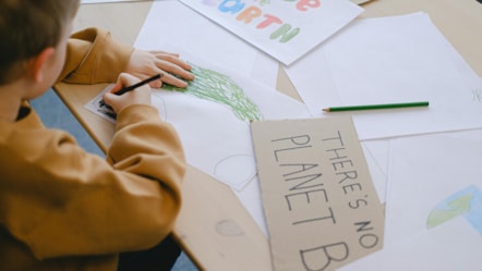 Child making climate change posters