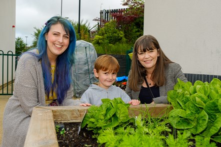 Minister for Children and Young People Clare Haughey with James and his mum Claire