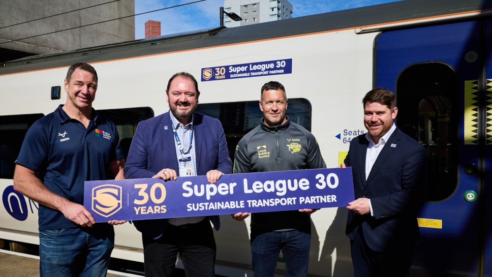 Adrian Morley, Danny McGuire, Alex Hornby and Bobby Bahadori with the Super League 30 train