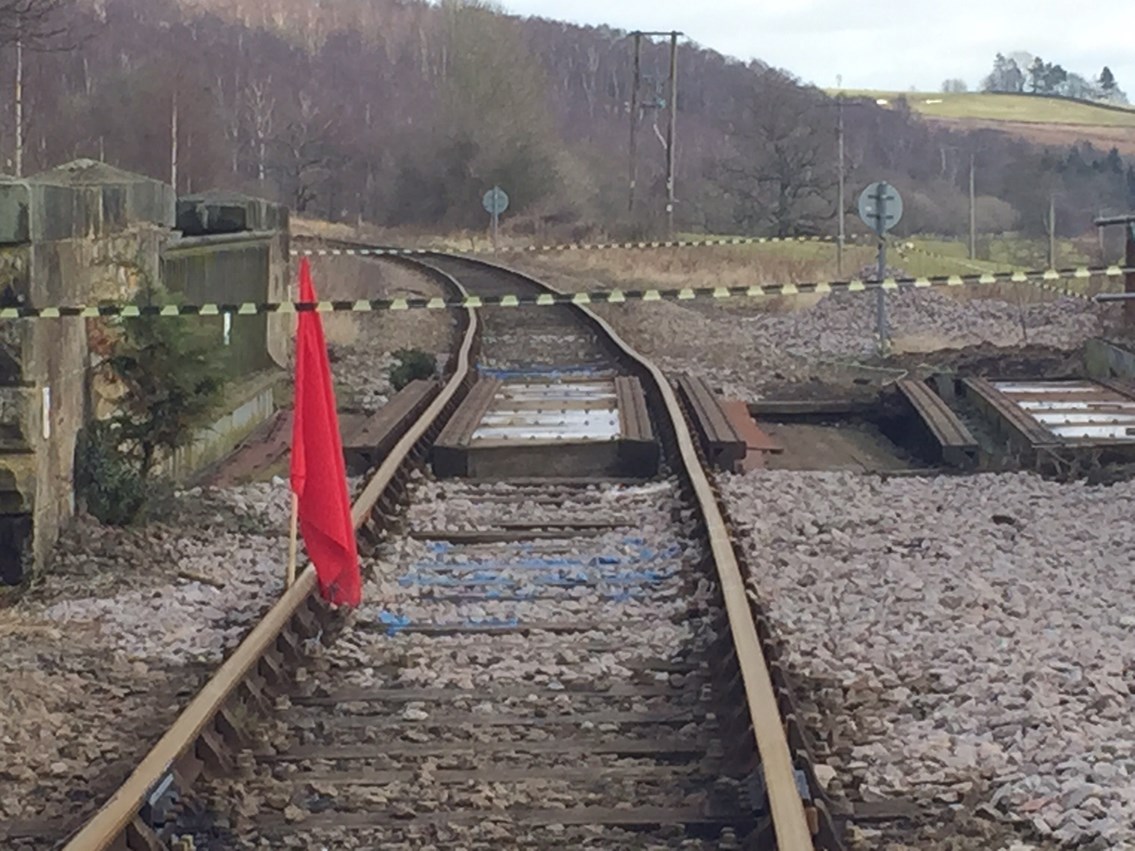 A photograph shows the misaligned track following a bridge strike at Castleton Moor