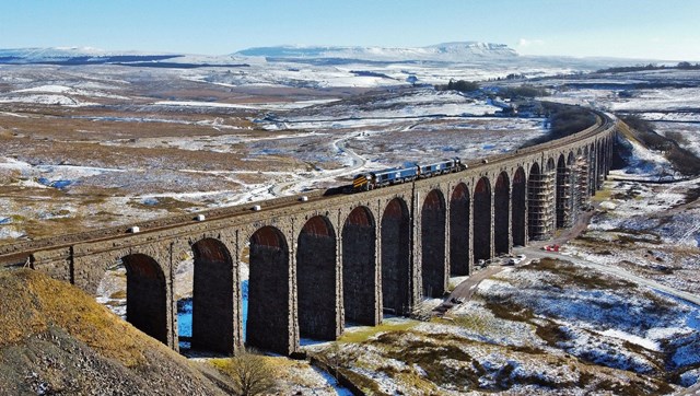 Progress at Ribblehead as plans submitted for extra viaduct repairs: Ribblehead viaduct with Network Rail route proving train and snowplough crossing Feb 11 2021 - Credit Tom Beresford