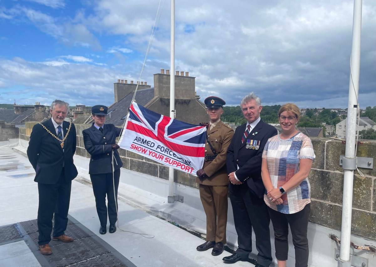 The council’s Service veteran – Cllr Donald Gatt (right) stands with Moray Council Leader Cllr Kathleen Robertson, Moray Council Civic Leader Cllr John Cowe, Fg Off Jessica Hunt of RAF Lossiemouth, and Lt Ethan Knight of 39 Engineer Regiment to raise the Armed Forces Day flag this morning (28 June) 