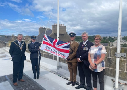 The council’s Service veteran – Cllr Donald Gatt (right) stands with Moray Council Leader Cllr Kathleen Robertson, Moray Council Civic Leader Cllr John Cowe, Fg Off Jessica Hunt of RAF Lossiemouth, and Lt Ethan Knight of 39 Engineer Regiment to raise the Armed Forces Day flag this morning (28 June) 
