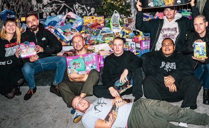 CFL Christmas appeal 1: Hardcore music fans brought over 600 toys to a gig at Boom Leeds to be donated to the Child Friendly Leeds gift appeal. Organiser Arran Gordon pictured fourth from the right. Picture credit: Amy Dorsman