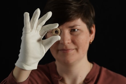 Janel Fontaine, Treasure Trove Officer, with the Medieval spindle whorl. Photo (c) Stewart Attwood. (2)