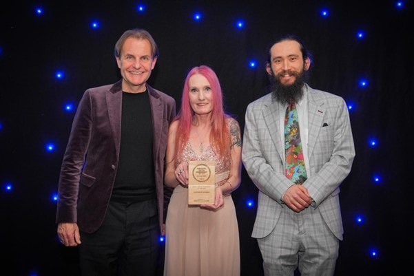 Customer advisor Charlie Jones, director Emma Stuart, and collections engagement assistant Phill Brant-Simmons with the Silver Award