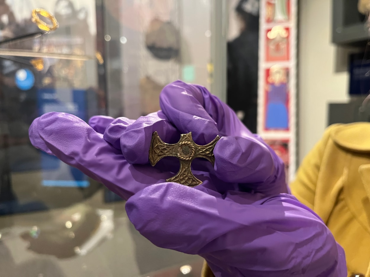 Saxon cross display: Believed to have once been a prestigious badge of office and a sign of religious identity, the silver, gilded pendant was discovered by a metal detectorist, with one of its four arms broken, and its central stone missing.
Newly created drawings, penned by archaeological illustrator John Prudhoe, show how the complete cross could have looked with its thin layer of gold leaf shining and a beautiful central garnet.