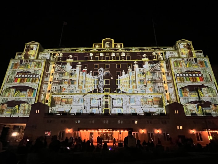 Light Night 2024: At The Queens Hotel The BookBinder saw a fairy tale figure lead a cast of birds, beasts and boats, in an impressive projection across the iconic hotel’s façade.
A collaboration with the British Library and created by artists Illuminos,  the piece is inspired by British Library’s Flickr Commons collection which includes fantastical drawings, prints and images.