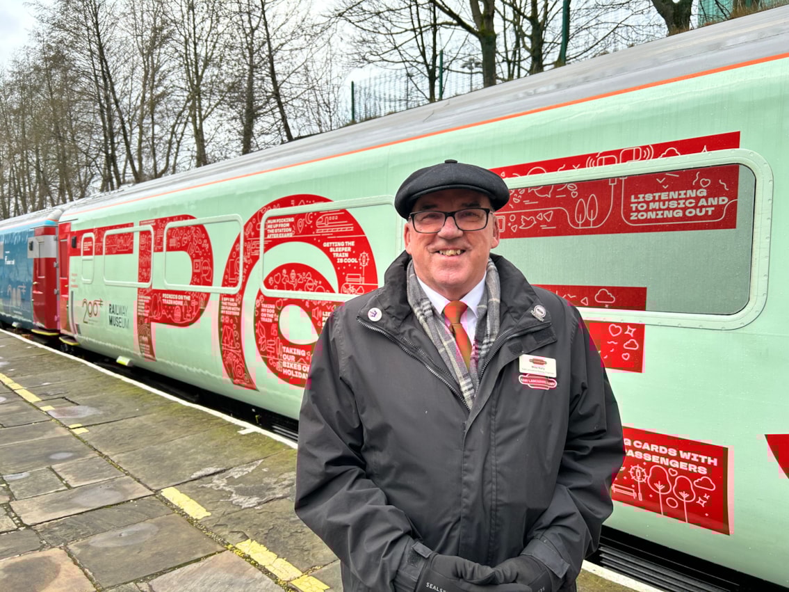 East Lancashire Railway chairman, Mike Kelly poses by the Inspiration Train