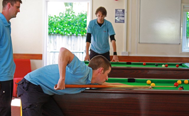 Network Rail apprentice playing pool in the break out area: Network Rail apprentice playing pool in the break out area