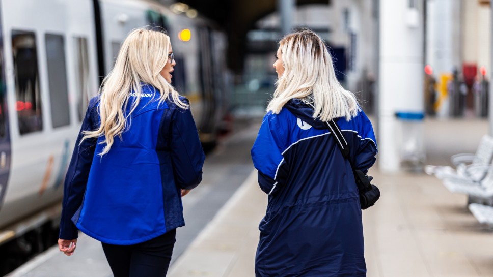 This image shows two female Northern staff members at a station