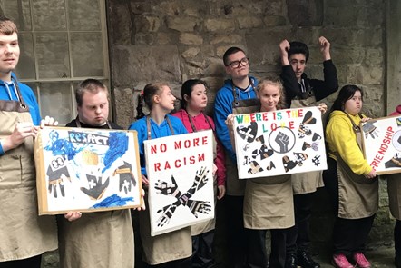 Pupils of Loyne Specialist School with placards created at a workshop