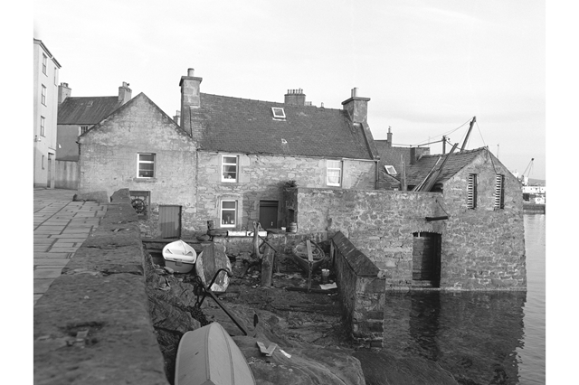 Lerwick, The Lodberrie View from E, 1976 (c) HES reproduced courtesy of J R Hume: Shetland Lodberries were built as merchants' trading posts - this one is best known as the house of Detective Inspector Perez from the BBC drama Shetland.