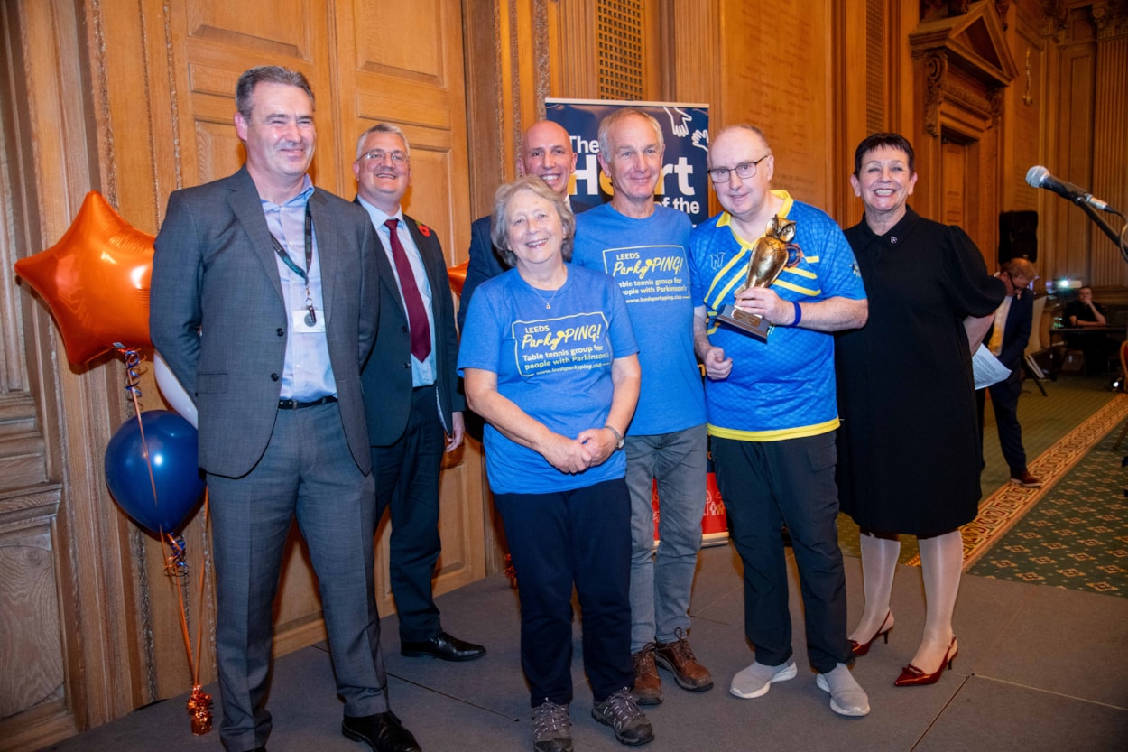 ParkyPING! Compassionate City Awards 1: Kirkstall-based ParkyPING!, a unique table tennis club for people with Parkinson’s disease, received the award for Community Sports Project of the Year at the Compassionate City Awards 2025. 

The awards celebrate the positive work people and organisations do to make a difference in their communities, with 2025's ceremony taking place on 6 November at Leeds Civic Hall.

Pictured with (from left) Paul Money, chief officer for Safer Stronger Communities, Councillor James Lewis, leader of the council, and Councillor Mary Harland, executive member for communities, customer service and community safety.