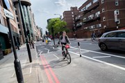 TfL Image - Santander Cycle customer on new cycleway at Mansell Street