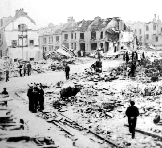 The corner of Giesbach Road and Boothby Road, Archway, after the V2 rocket attack. The corner and destroyed houses are now covered by Giesbach Road Open Space. Image Credit: Islington Local History Centre
