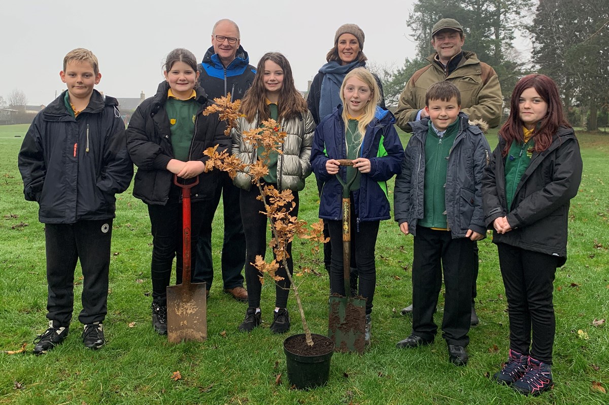 Back row L-R: Stephen Simpson (Head Teacher); Countess and Earl of Moray. Front row L-R: Tom Rhind; Millie Coleman; Michelle Savage; Keira Simpson; Boyd Millar; Bella Mathias.