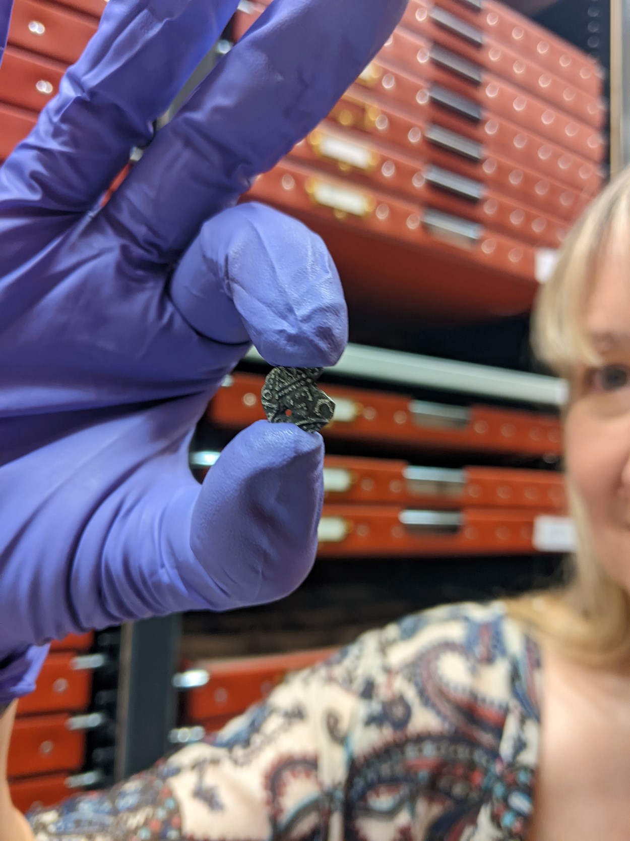 Money Talks: Kat Baxter, curator of archaeology and numismatics, holds the newly-acquired sceat, among the littlest coins ever made in Britain, which was unearthed by an eagle-eyed detectorist on a patch of land in Leeds.