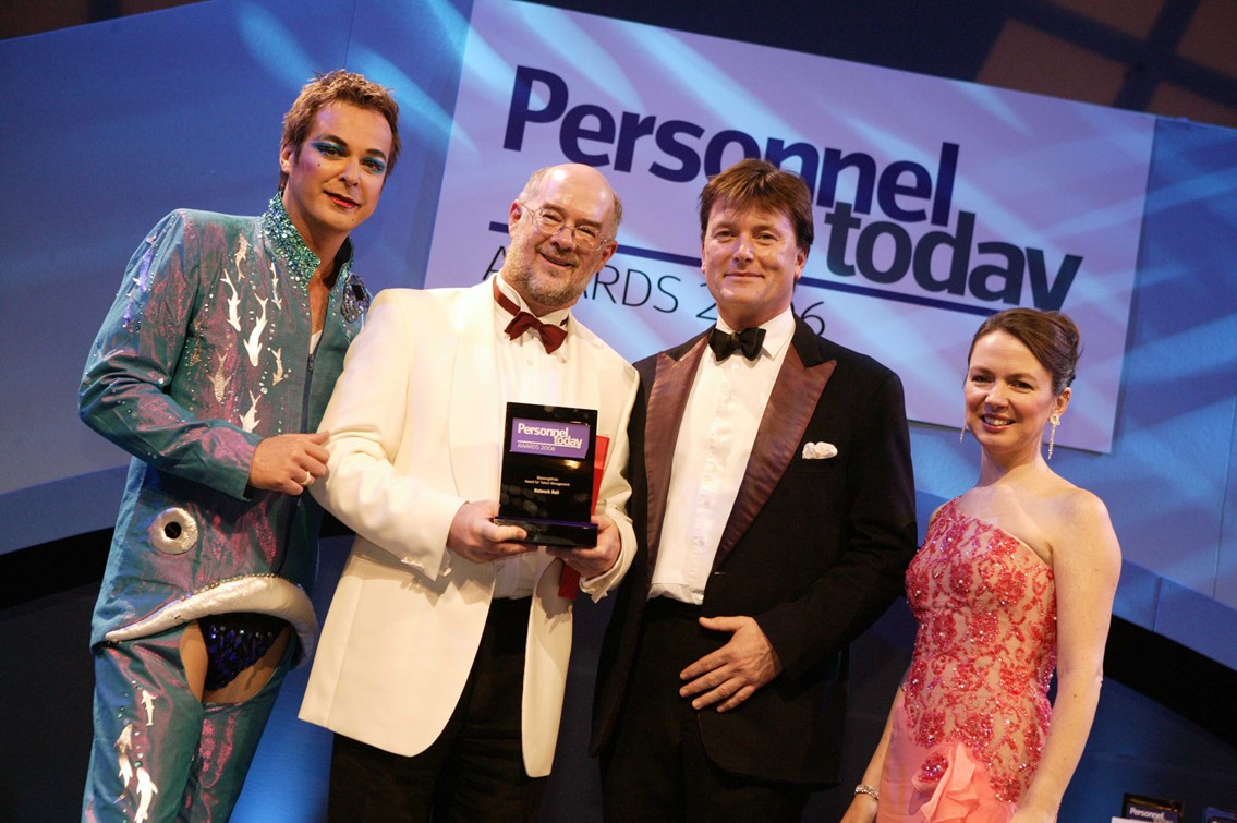 Personnel Today Awards 2006: Shown accepting the Personnel Today Award for Talent Management from Julian Clary is Bob Hughes, Network Rail’s talent and employee engagement manager, (second from left) with Tom Barry, UK managing director of Blessing White, which sponsored the award category, and Karen Dempsey, editor of Personnel Today
