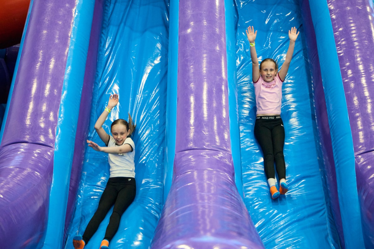 Children enjoying the inflatable zone at Sobell Leisure Centre