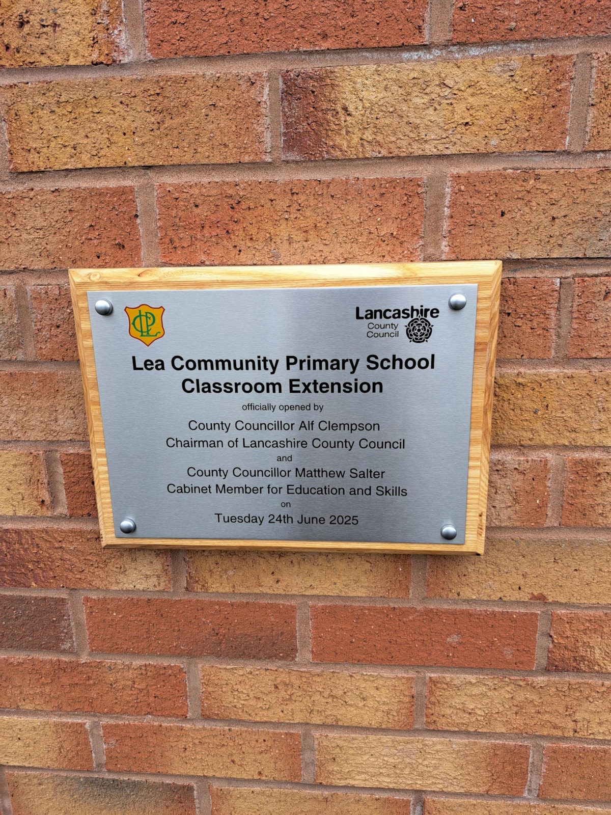 Plaque marking the handover of new facilities at Lea Community Primary School