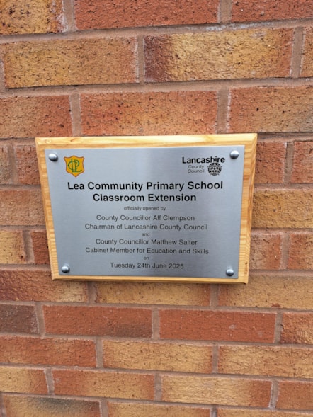 Plaque marking the handover of new facilities at Lea Community Primary School