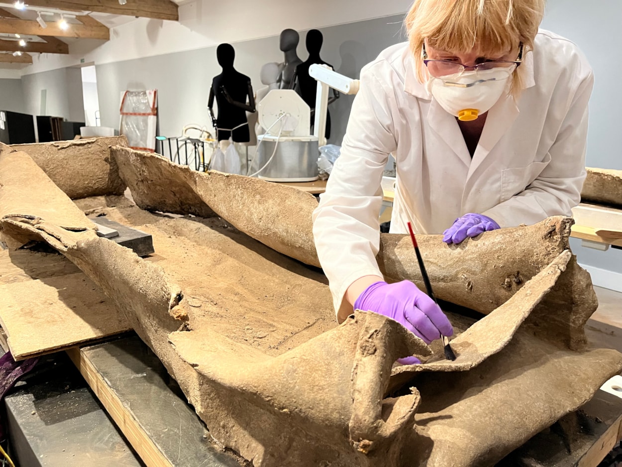 Living with Death coffin display: Emma Bowron, conservator with Leeds Museums and Galleries, works on the ancient lead coffin which lay buried in a Leeds field for more than 1,600 years.
The astonishing discovery, described by experts as a once-in-a-lifetime find, was made during excavation work by West Yorkshire Archaeological Services in a previously unknown site near Garforth.
It will go on display at Leeds City Museum in May as part of a new exhibition called Living with Death.