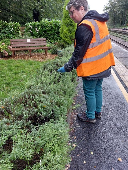 Image shows volunteer at Hindley station