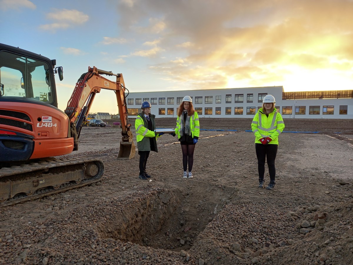 Burial of time capsule at Lossiemouth High School: L-R: Lossie High's youngest pupil, Markey O'Donnell (S1); Head Prefect, Caitlin McDermott (S6); Social Impact Advisor for Balfour Beatty, Bethany Welsh.