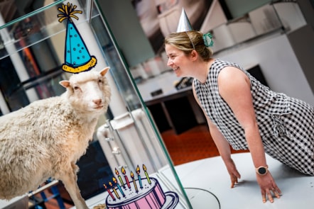 Curator Sophie Goggins with Dolly the sheep. Image © Andy Catlin
