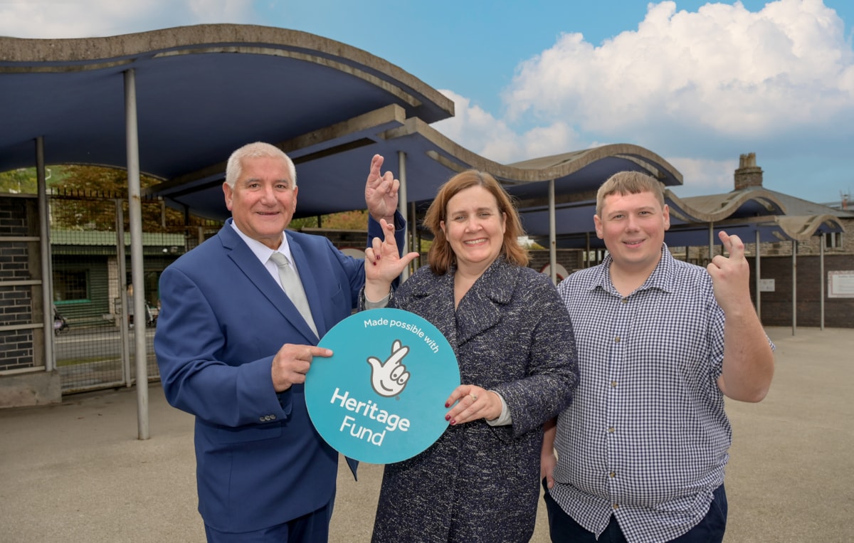 Councillor Patrick Harley, Liz Bates and Councillor Simon Phipps fingers crossed