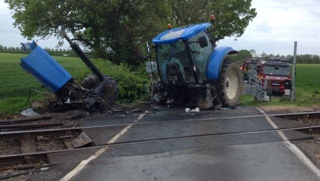 Tractor crash: Tractor after collision with a train at a level crossing during harvest (May 2015)
