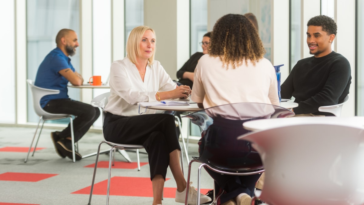 Colleagues talking in a meeting cropped