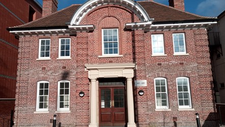 The front of the new Arthur Hill affordable homes for key workers, which has retained the old swimming pool's original facade