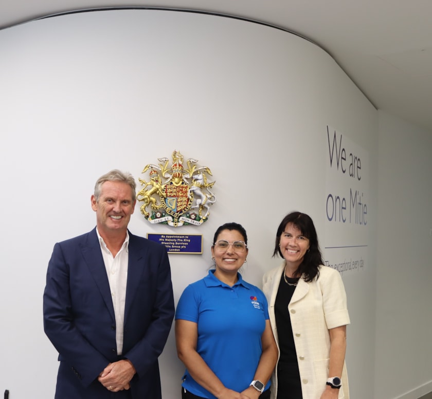 Phil Bentley, CEO, Mitie, Priscila De Paula, a colleague in the Mitie Cleaning Team and Kathryn Dolan, CPO, Mitie photographed celebrating Mitie's Royal Warrant