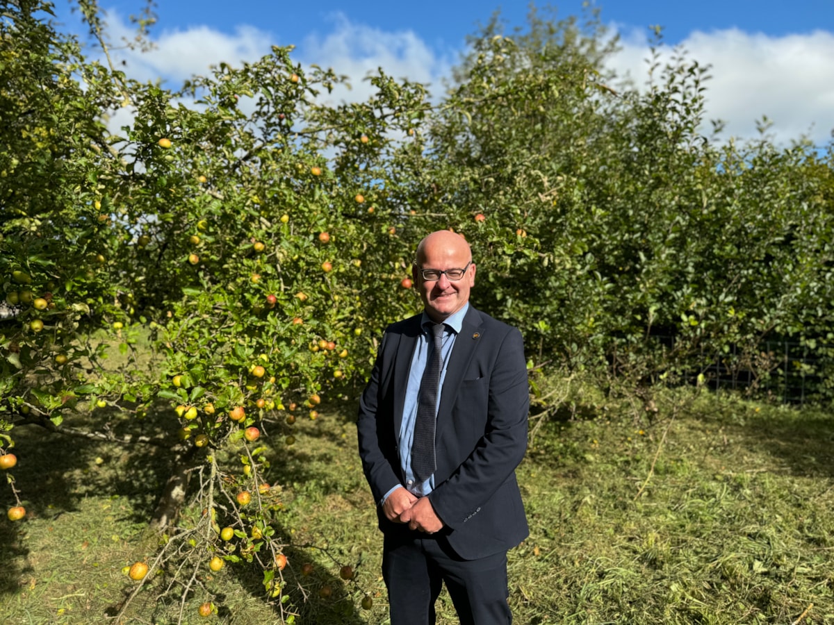 Cllr Shaun Turner with trees behind him